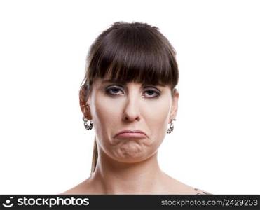 Close-up portrait of a lovely woman with a sad expression against white background