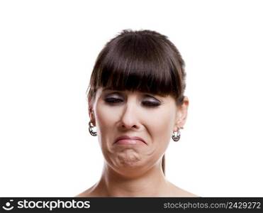 Close-up portrait of a lovely woman with a sad expression against white background