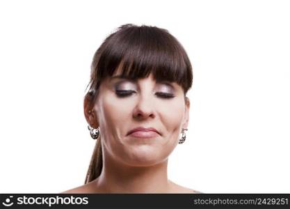 Close-up portrait of a lovely woman with a suspicious expression against white background