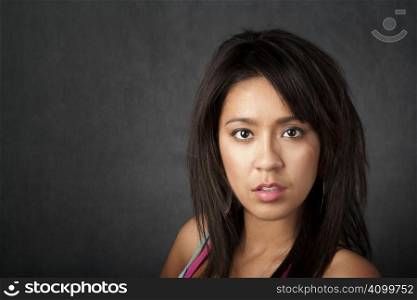 Close up portrait of a pretty brunette woman with copy space