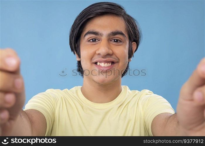 Close-up portrait of a teenage boy taking selfie