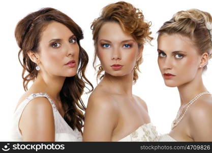 Close Up, Portrait of a three beautiful woman in wedding dress isolated over white background