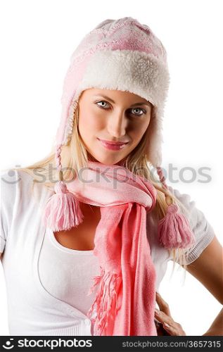 close up portrait of a young beautiful model in white winter dress with a nice hat and pink scarf