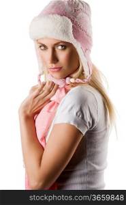 close up portrait of a young beautiful model in white winter dress with a nice hat and pink scarf