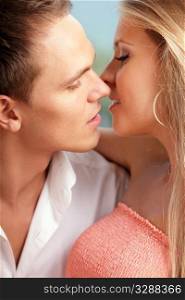 close-up portrait of a young loving couple ready to kiss