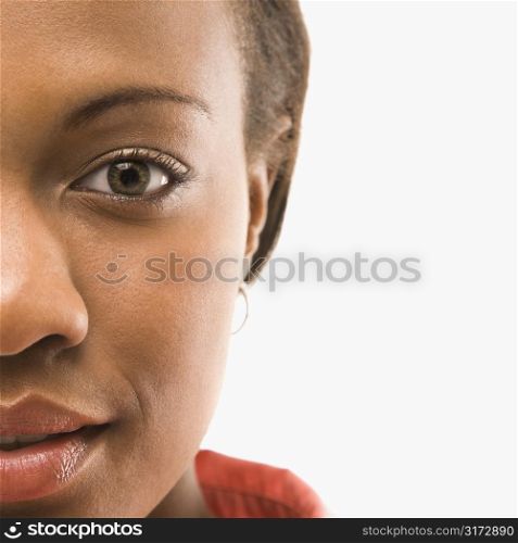 Close up portrait of African American woman against white background.