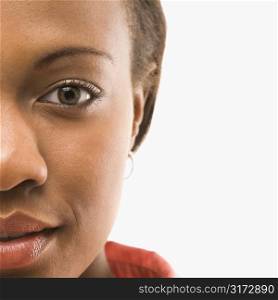Close up portrait of African American woman against white background.