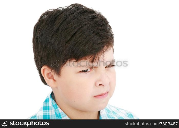 Close-up portrait of angry little boy isolated on white background
