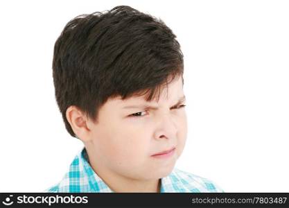 Close-up portrait of angry little boy isolated on white background