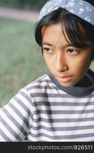 Close-up portrait of Asian little girl a pose in the park