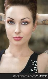 Close up portrait of attractive tattooed woman.