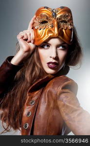 close-up portrait of attractive woman in mask and jacket