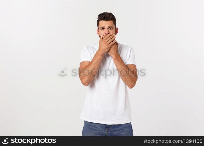 Close up portrait of attractive young man closing his mouth with fingers. Worried gesture, can&rsquo;t say anything. Close up portrait of attractive young man closing his mouth with fingers. Worried gesture, can&rsquo;t say anything.