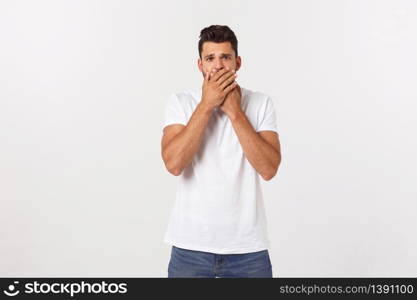 Close up portrait of attractive young man closing his mouth with fingers. Worried gesture, can&rsquo;t say anything. Close up portrait of attractive young man closing his mouth with fingers. Worried gesture, can&rsquo;t say anything.