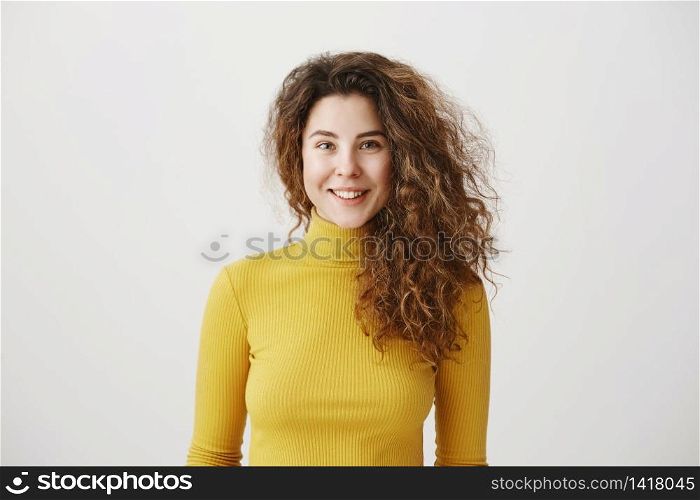 Close-up portrait of beautiful tender brunette woman looking , isolated on grey background.. Close-up portrait of beautiful tender brunette woman looking , isolated on grey background