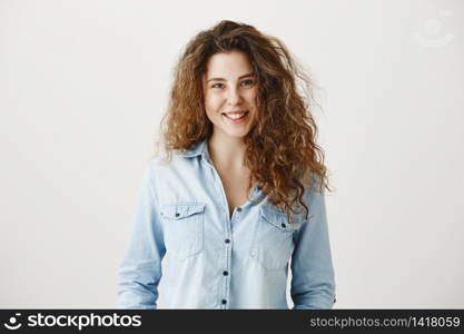 Close-up portrait of beautiful tender brunette woman looking , isolated on grey background.. Close-up portrait of beautiful tender brunette woman looking , isolated on grey background