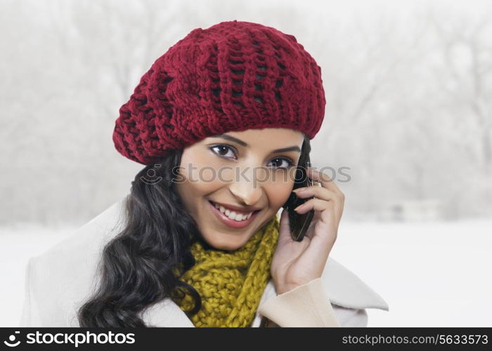 Close-up portrait of beautiful woman talking on cell phone