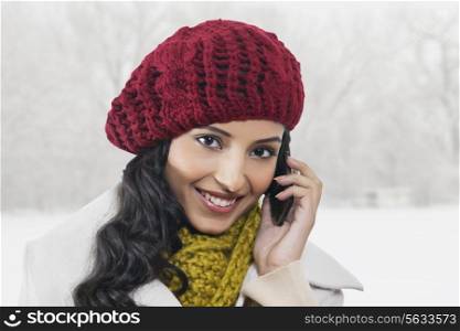 Close-up portrait of beautiful woman talking on cell phone