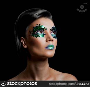 Close-up portrait of beautiful woman with professional make-up Fashion Model Girl. black background