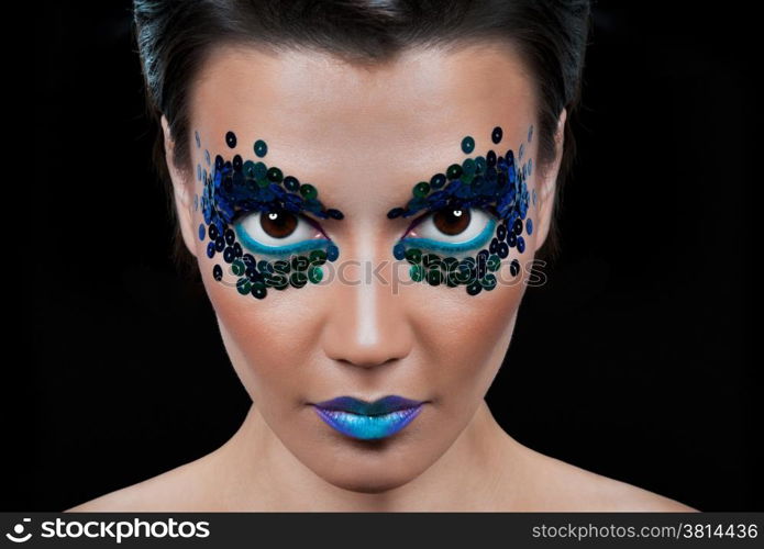 Close-up portrait of beautiful woman with professional make-up Fashion Model Girl. black background