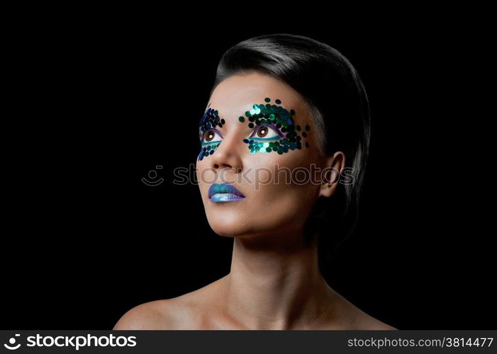 Close-up portrait of beautiful woman with professional make-up Fashion Model Girl. black background