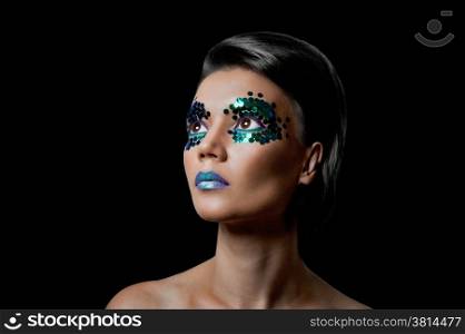 Close-up portrait of beautiful woman with professional make-up Fashion Model Girl. black background