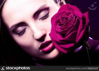 close-up portrait of beautiful woman with rose