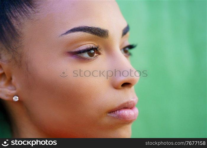 Close-up portrait of beautiful young black girl outdoors. Close-up portrait of beautiful young black girl