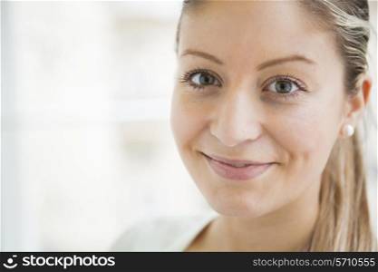 Close-up portrait of beautiful young woman smiling