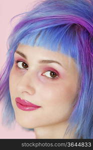 Close-up portrait of beautiful young woman with dyed hair