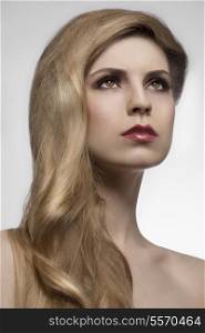 close-up portrait of beauty girl with cute long elegant hair-style, perfect shiny blonde hair. Hair-care concept. Extension