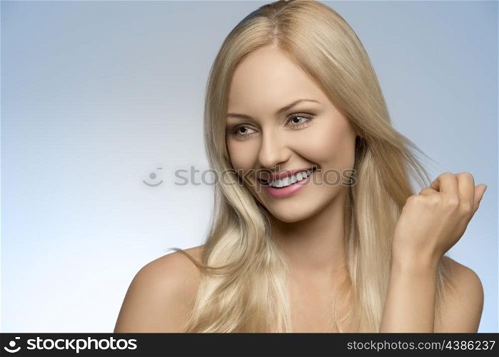 close-up portrait of beauty smiling girl with natural style, perfect skin and smooth blonde hair