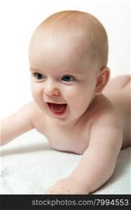 close up portrait of blue eyed baby boy isolated on white background