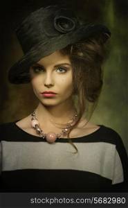 close-up portrait of charming woman with fashion black hat, striped dress and necklace