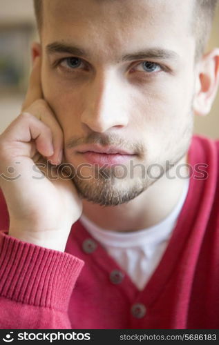 Close-up portrait of confident man in cafe