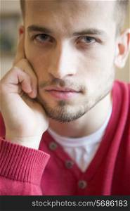Close-up portrait of confident man in cafe