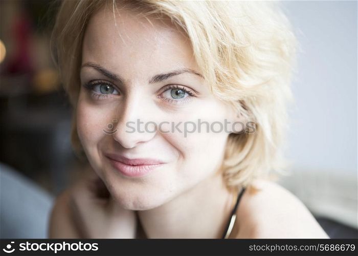 Close-up portrait of confident woman in cafe