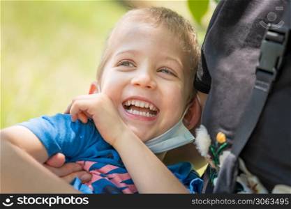 Close up portrait of cute little son hug cuddle laughing enjoying free time together, little boy child smile hug shows love and care