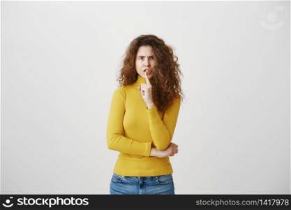 Close up portrait of cute lovely attractive uncertain unsure with entrepreneur making hush gesture isolated on gray background copy-space.. Close up portrait of cute lovely attractive uncertain unsure with entrepreneur making hush gesture isolated on gray background copy-space