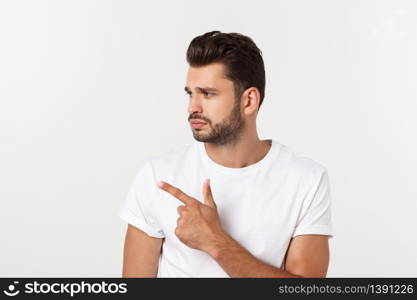 Close up portrait of disappointed stressed bearded young man in shirt over white background. Close up portrait of disappointed stressed bearded young man in shirt over white background.