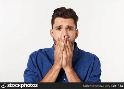 Close up portrait of disappointed stressed bearded young man in shirt over white background. Close up portrait of disappointed stressed bearded young man in shirt over white background.