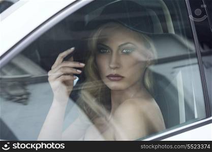 close-up portrait of fashion girl posing in white car with black hat, cute make-up, blonde hair and aristocratic style