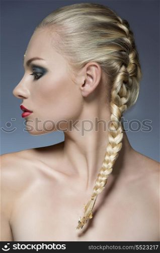 close-up portrait of female profile with creative strong make-up and bride blonde hair-style