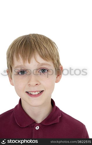 Close-up portrait of happy blond boy over white background