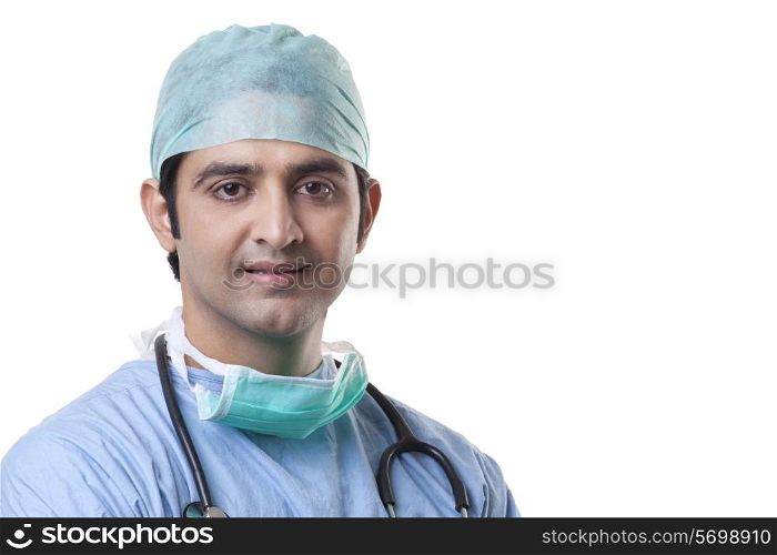 Close-up portrait of male surgeon over white background