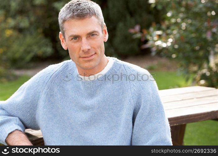 Close Up Portrait Of Man Standing Outside In Autumn Landscape
