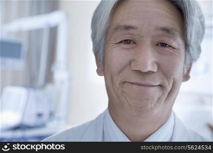 Close-up portrait of mature male doctor in the hospital