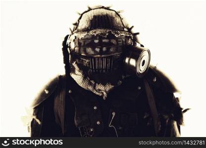Close up portrait of nuclear post-apocalypse survivor, living underground mutant or creature, skilled stalker wearing rags and armored full-face gas mask or air breathing apparatus, toned shoot. Portrait of post apocalyptic survivor in gas mask