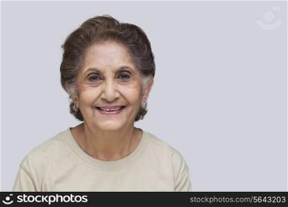 Close-up portrait of old woman smiling