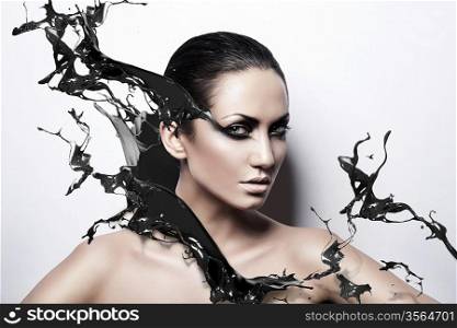 close up portrait of passion brunette woman with black splash